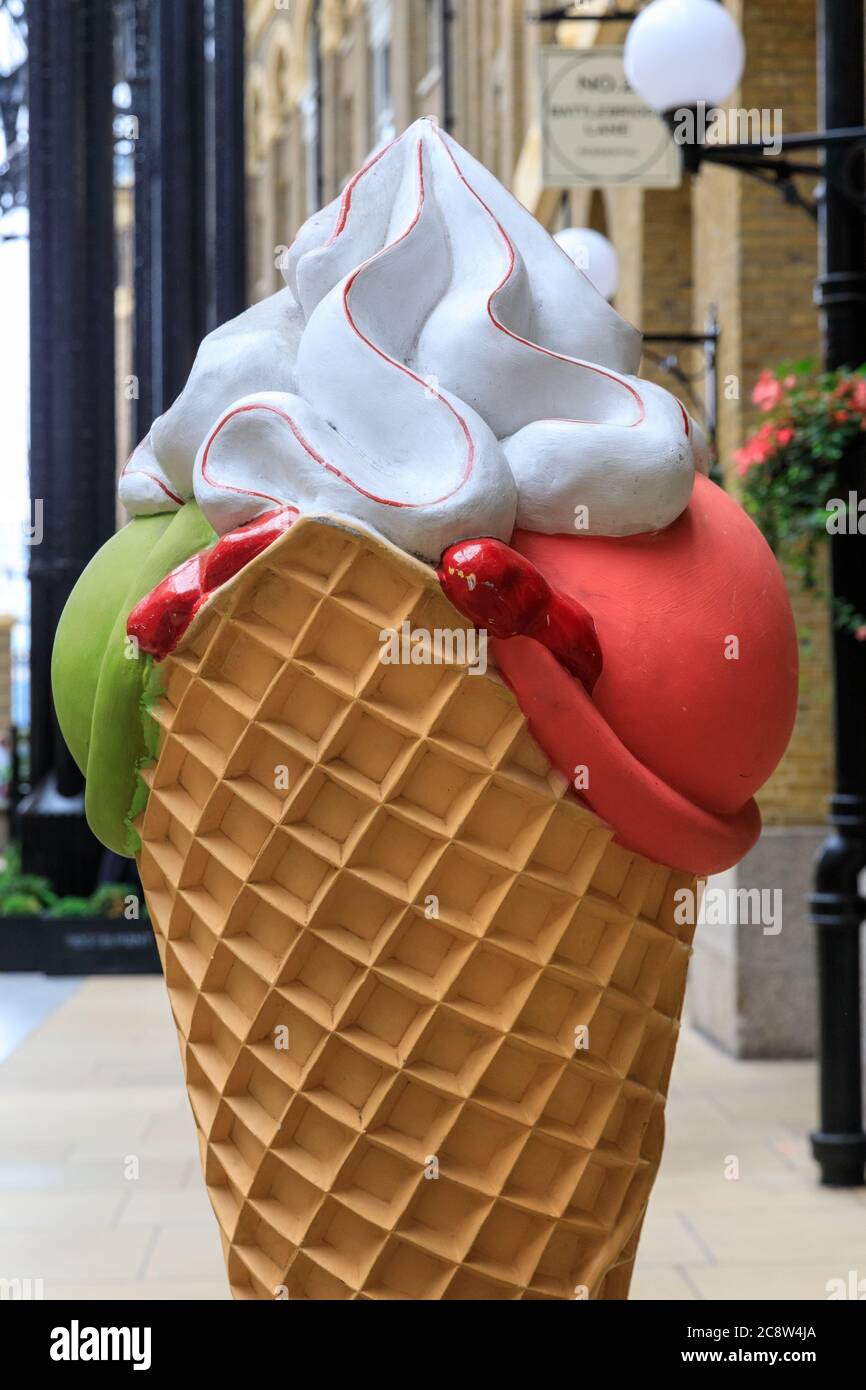 Giant decorative ice cream cone with whipped cream, promotional decor