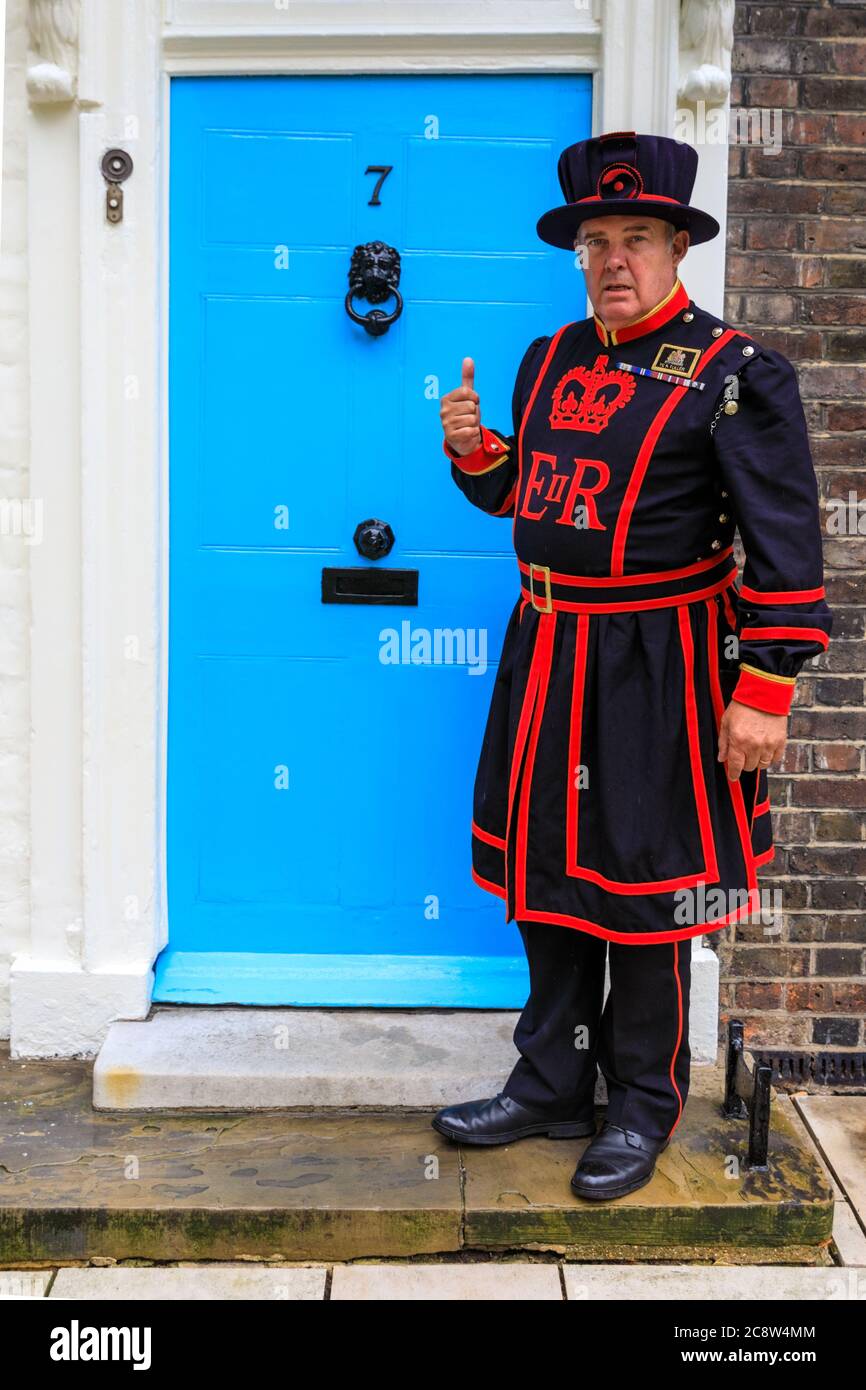 A Yeoman Warder also known as Beefeater at the Tower of London, Her Majesty's Royal Palace and Fortress the Tower of London, England, UK Stock Photo