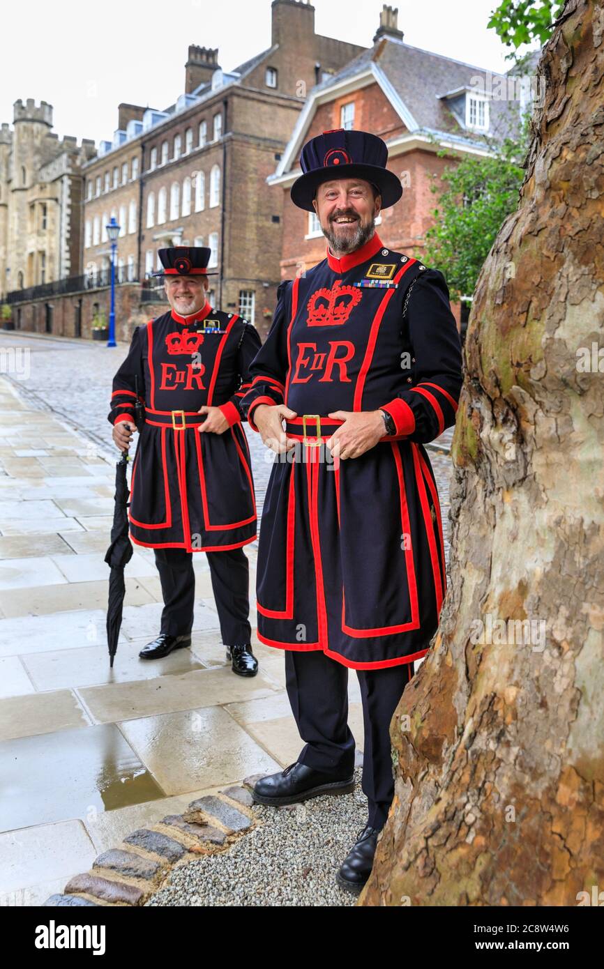 Yeoman Warders, also known as Beefeaters at the Tower of London, Her Majesty's Royal Palace and Fortress the Tower of London, England, UK Stock Photo
