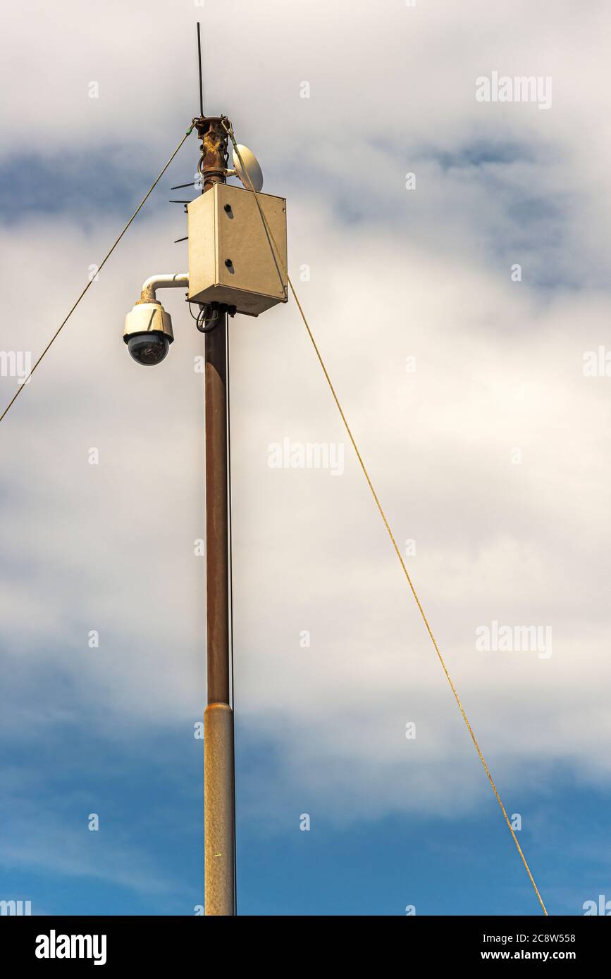 steel pole with power box for electrical supply to a surveillance camera Stock Photo