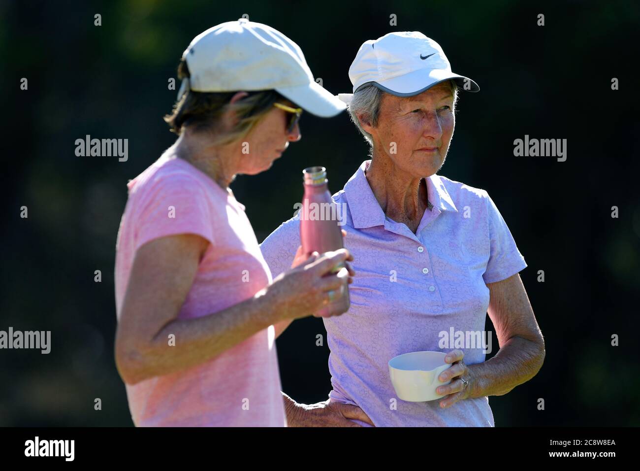 Older ladies take time out for refreshments during a local tennis tournament in Victoria Australia Stock Photo