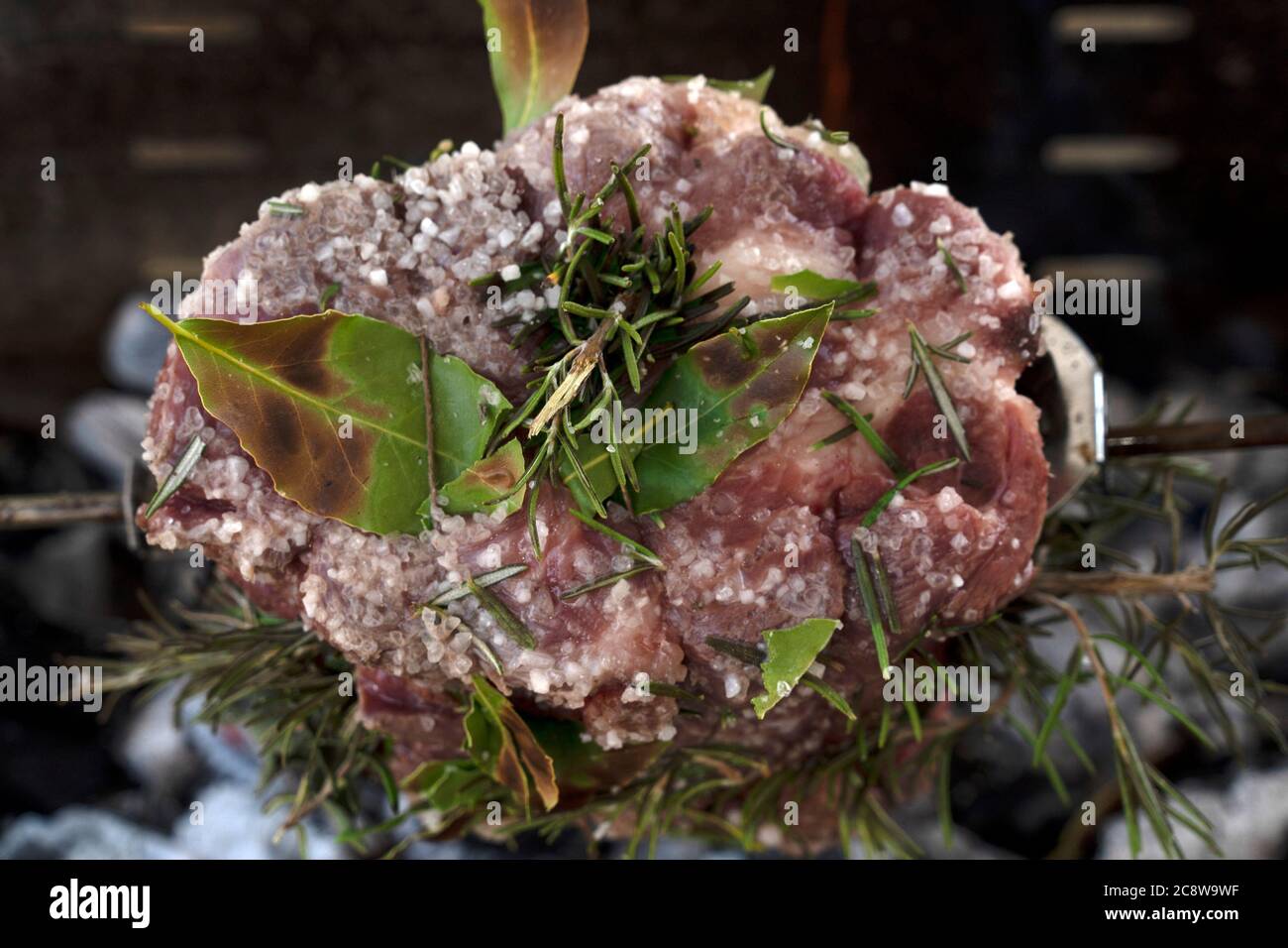pork roast while cooking on charcoal barbecue Stock Photo Alamy