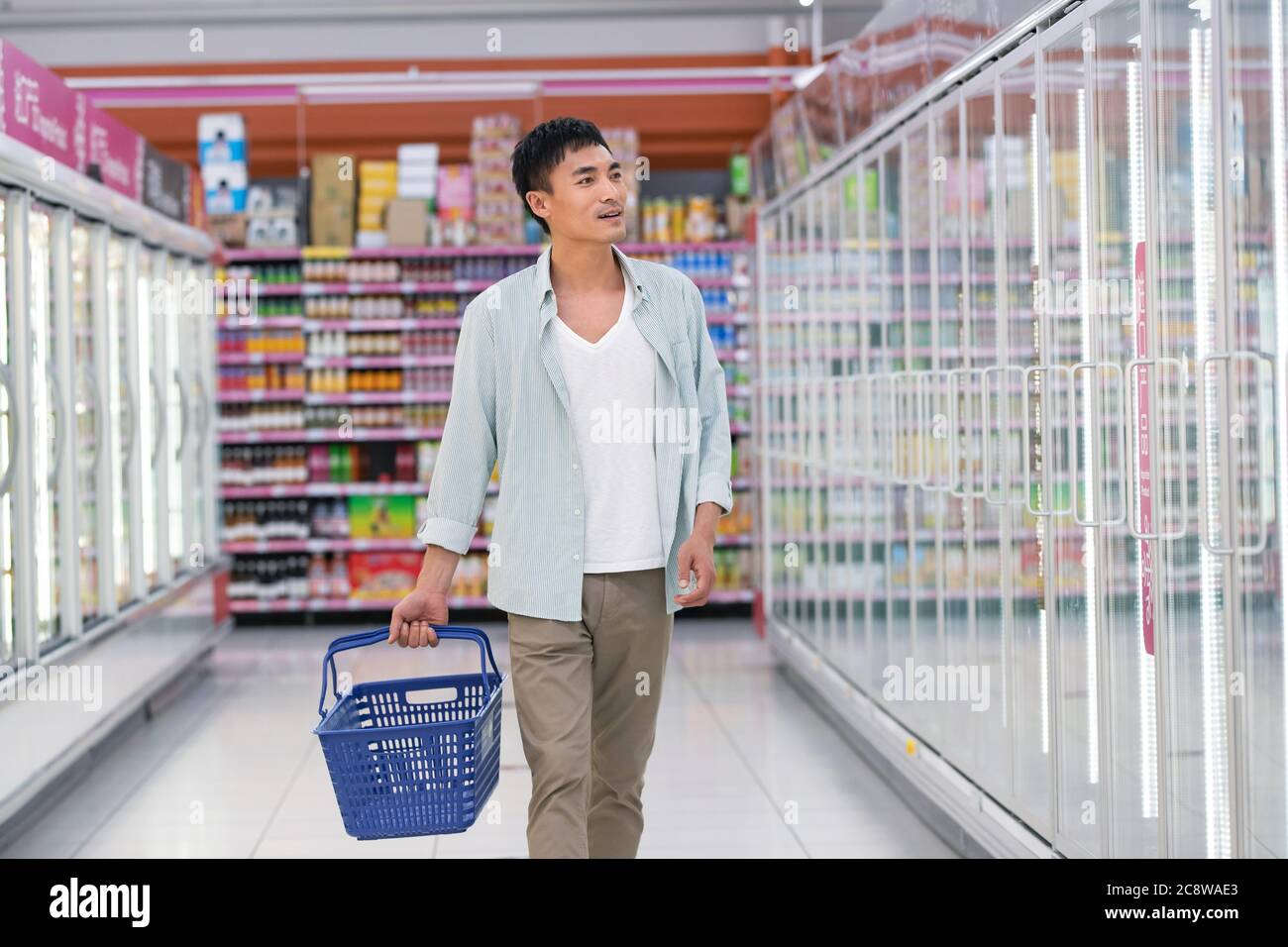 Middle-aged men shopping in the supermarket Stock Photo
