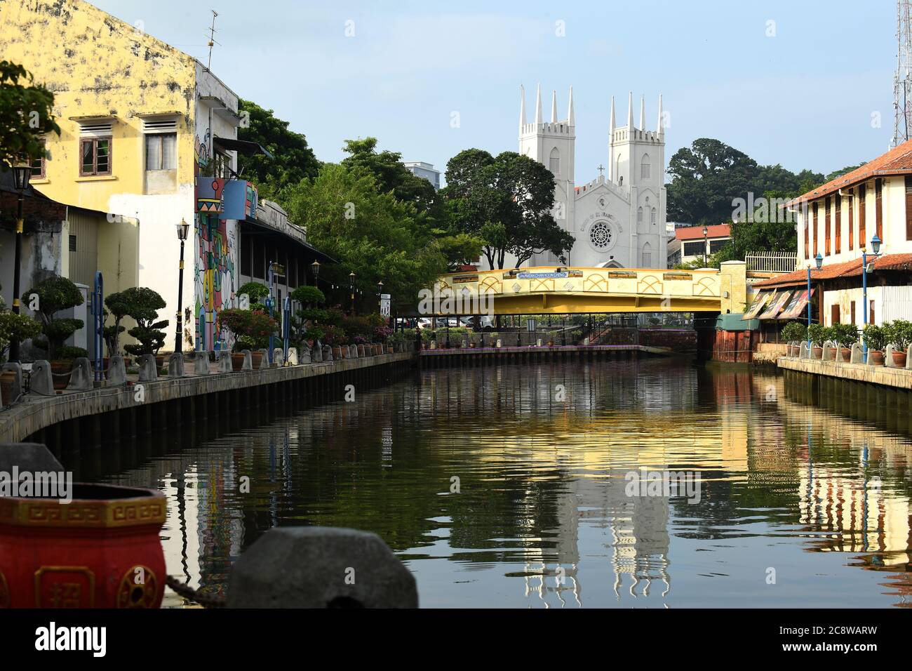 The Church of St. Francis Xavier reflects in the Melacca River 