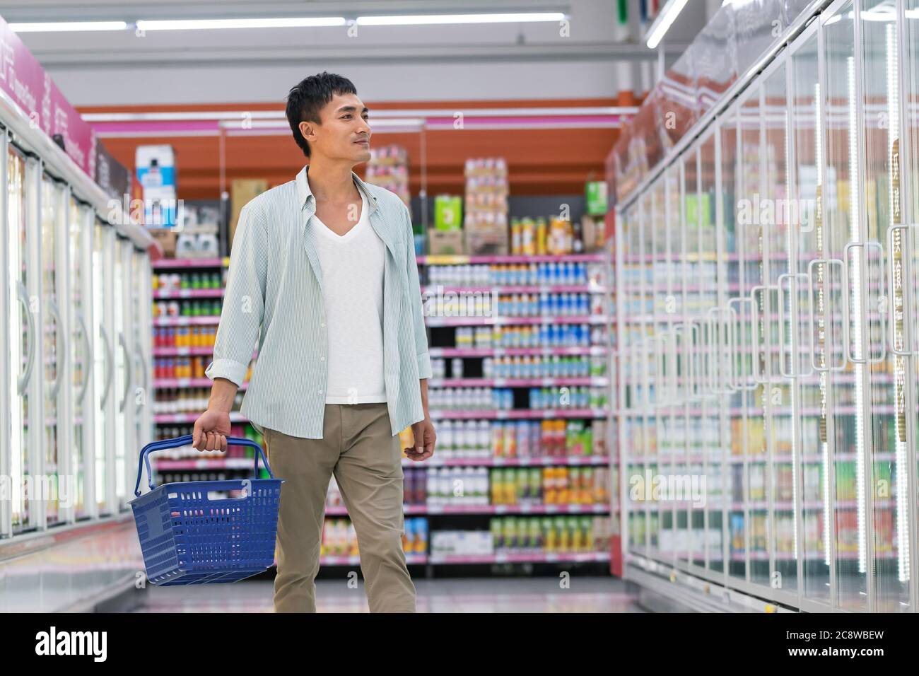 Middle-aged men shopping in the supermarket Stock Photo