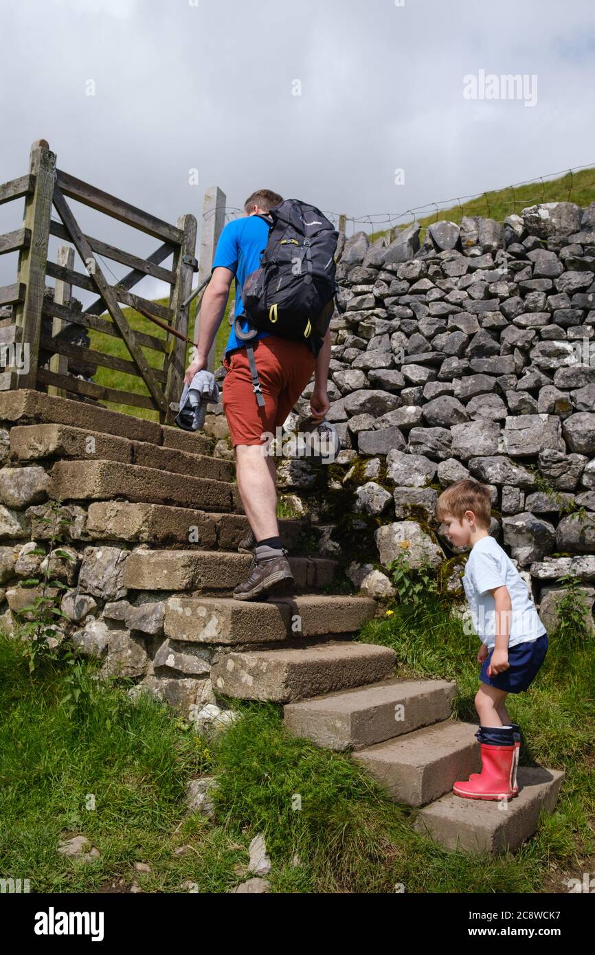 Four Year Old boy with his Father at Gordale in the Yorkshire Dales, UK. Stock Photo