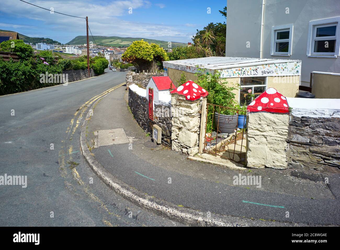 Quirky red and white spotted gate post tops at St Mary's Road, Port Erin,  Isle of Man Stock Photo - Alamy