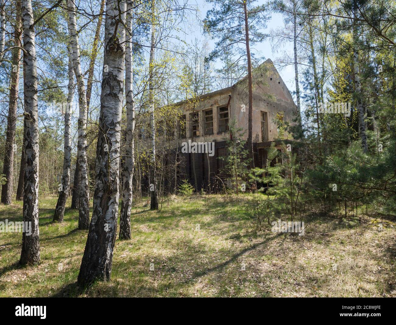 Czech Republic, Ralsko, April 26, 2019: Abandoned ruined house building at former Soviet army military training range area in the middle of woods Stock Photo
