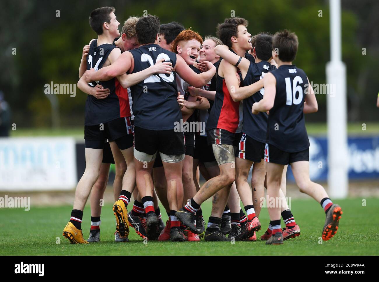 Myrtleford Saints' celebrate their triumph over the Wangaratta Imperials following a grass roots regional football final in North East Victoria, Austr Stock Photo