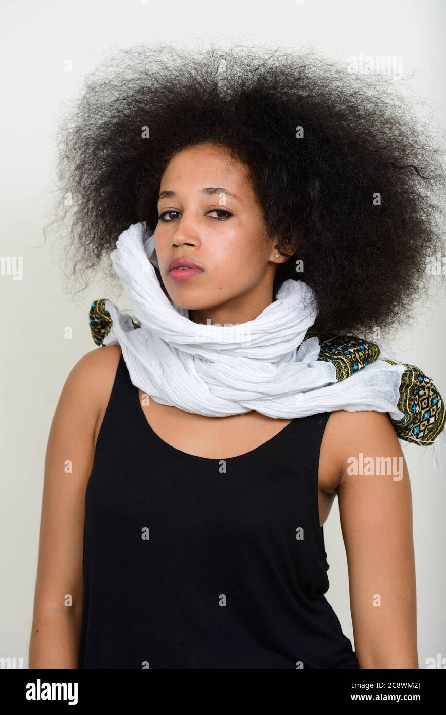 Portrait of young beautiful African woman with Afro hair in traditional ...