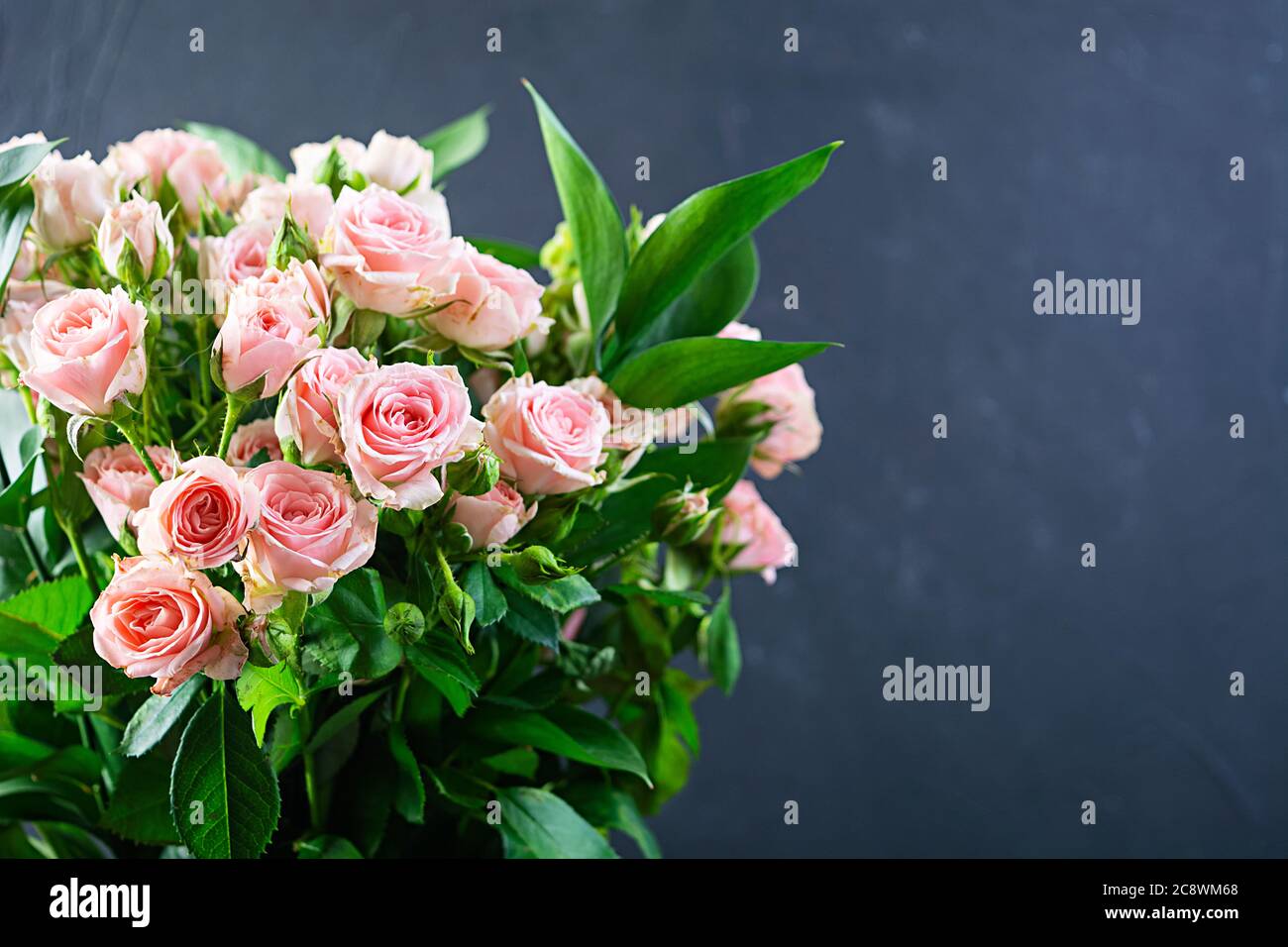 Bouquet of several branches of pink roses. Background of pink roses ...