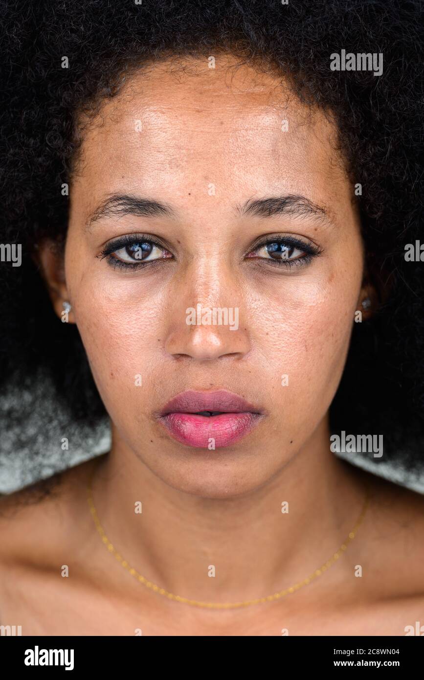 Portrait of young beautiful African woman with Afro hair Stock Photo ...