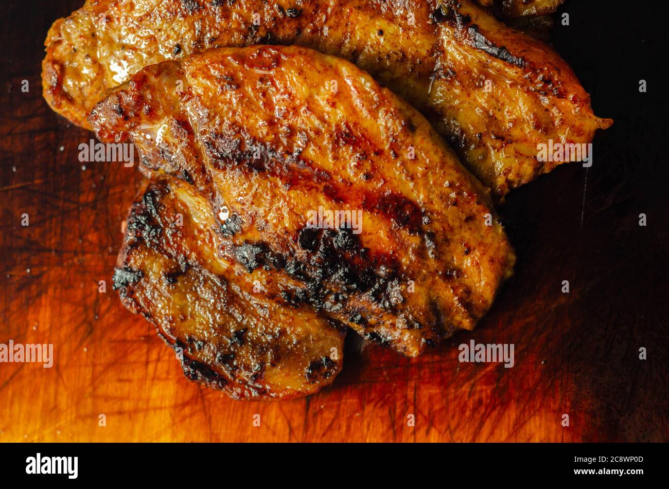Fresh and juicy pork loin steaks, grilled meats on the wooden board