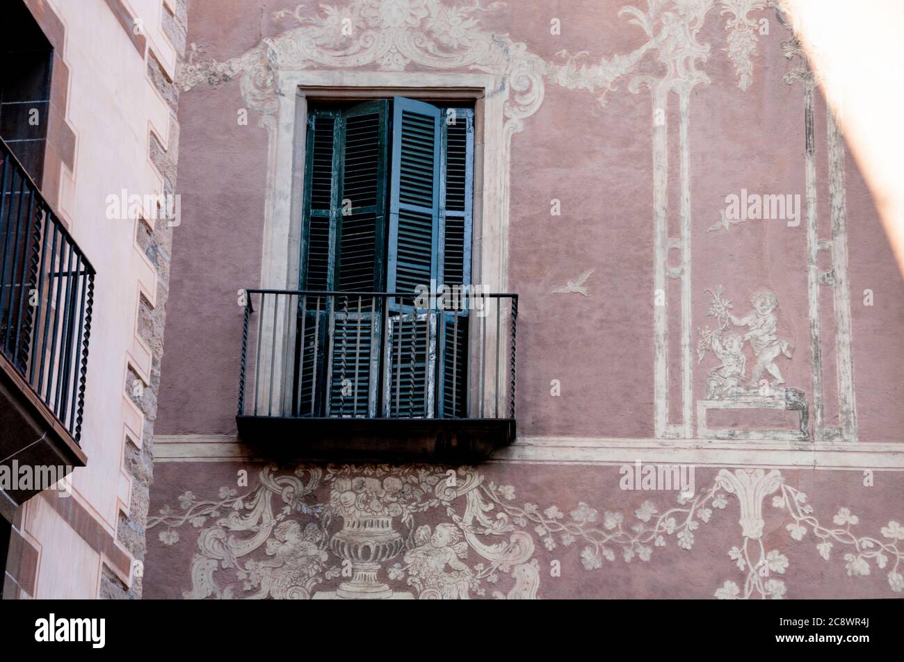 Sgraffito, a baroque gothic style of wall decor scratched into plaster in the Bari Gothic neighborhood of Barcelona, Spain. Stock Photo