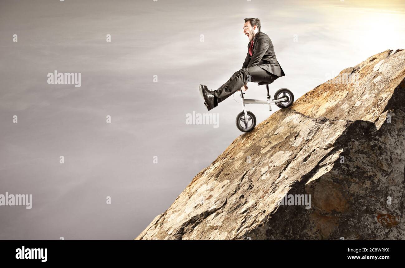 Bicycle businessman descending from a fall free fall Stock Photo