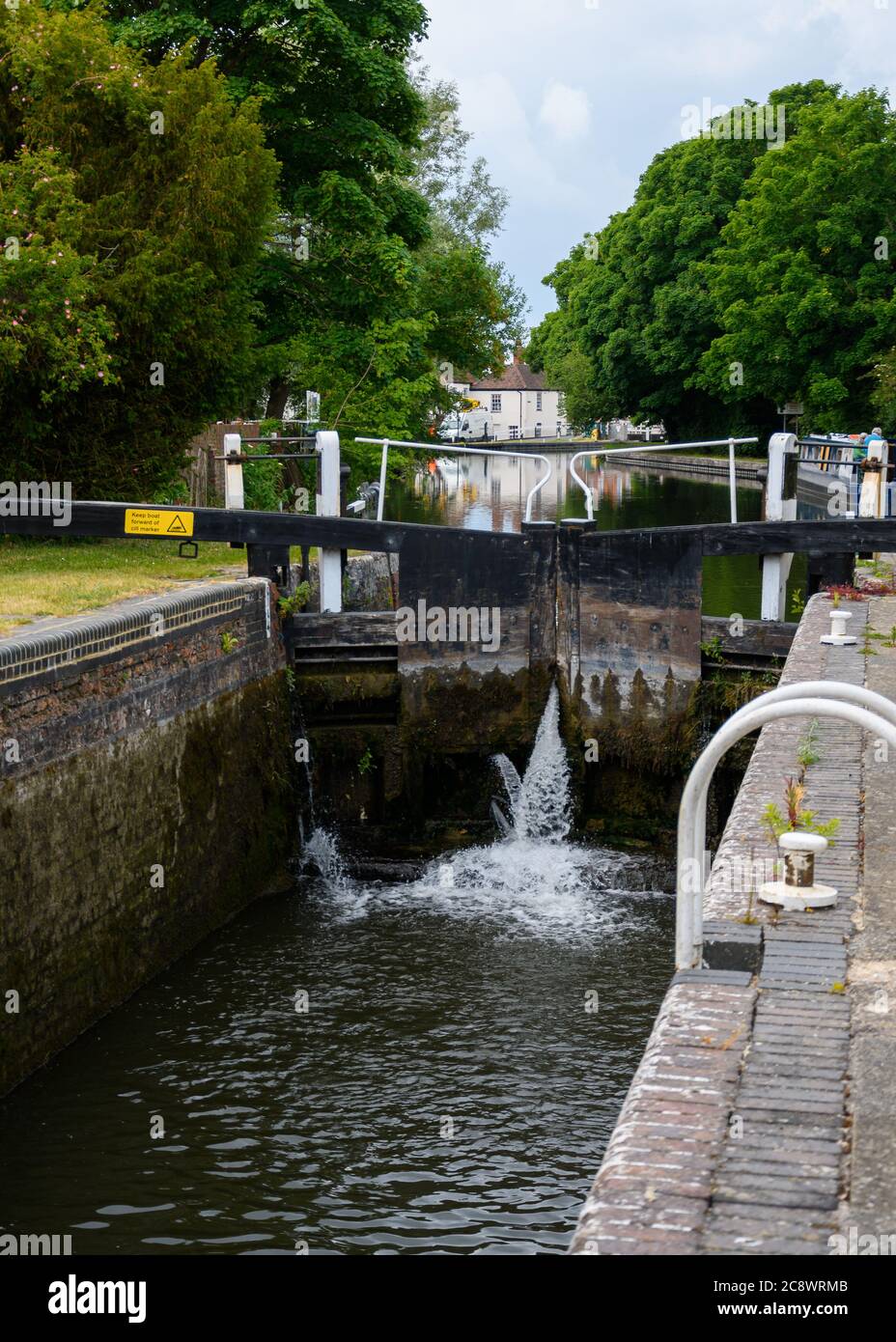 Newbury, United Kingdom - June 09 2020:  A lock gate leaking water into the lock on the River Kennet by Northcroft Lane Stock Photo