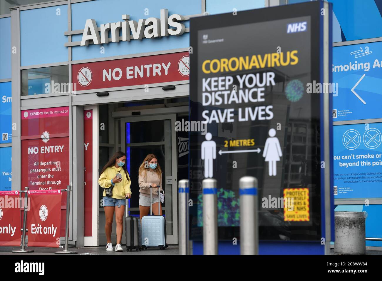 Passengers at Birmingham Airport, as people arriving into England from holidays in Spain have been told they must quarantine when they return home. Stock Photo