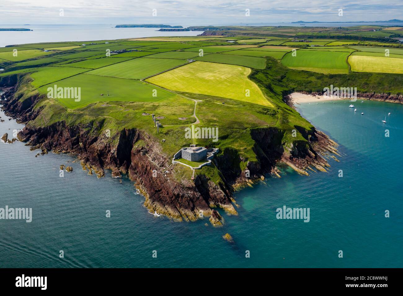 Aerial view of 19th century coastal fort on clifftops surrounded by fields and ocean (Milford Haven, Wales) Stock Photo