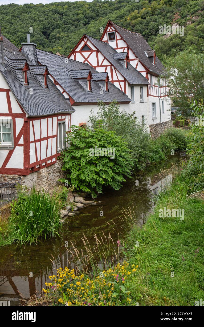 Rural scene with halftimbered houses beside a creek in a typical