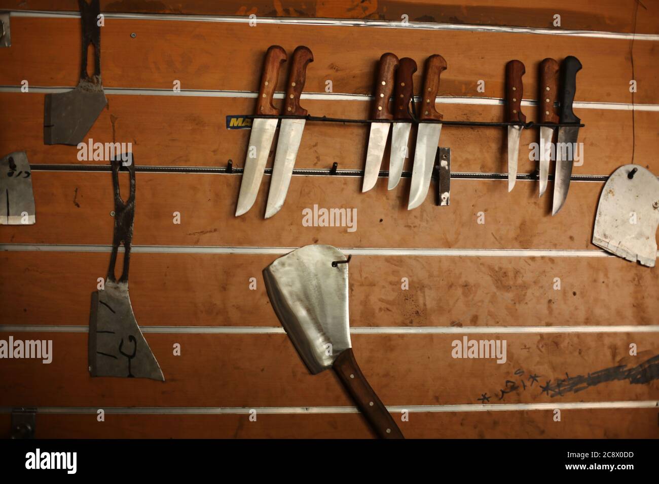 An old whetstone for sharpening knives. Grinding wheel on an old tripod.  Season of the autumn Stock Photo - Alamy