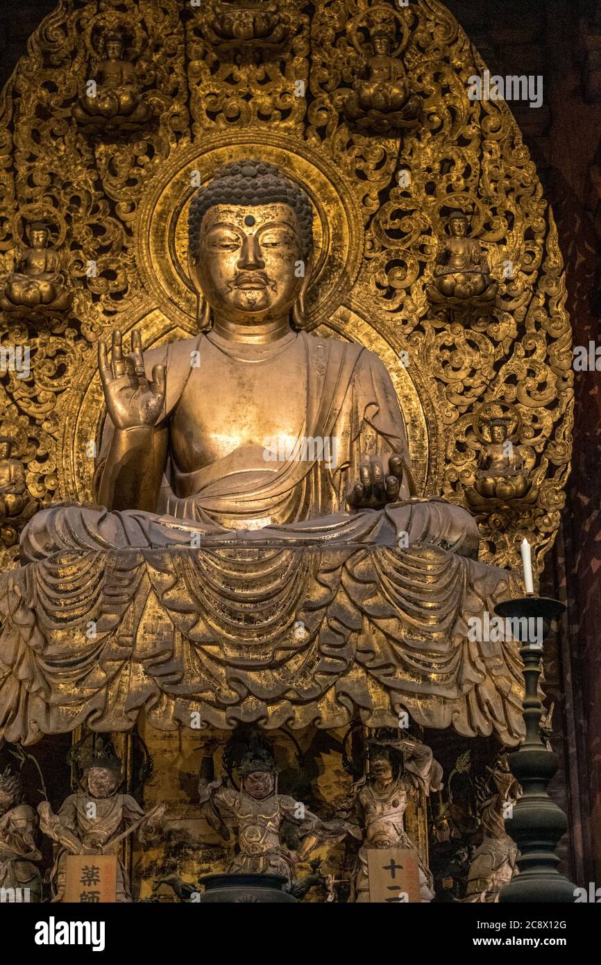 Gold statue in Japan, religion Stock Photo Alamy