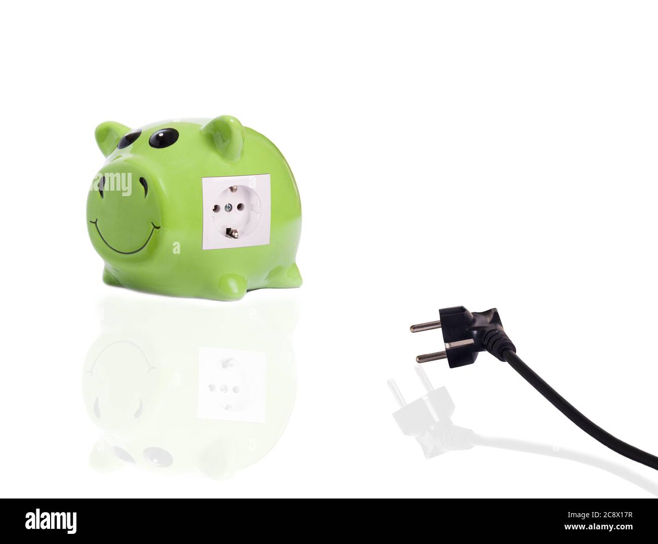 Closeup shot of a green pig bank with an electrical socket Stock Photo ...