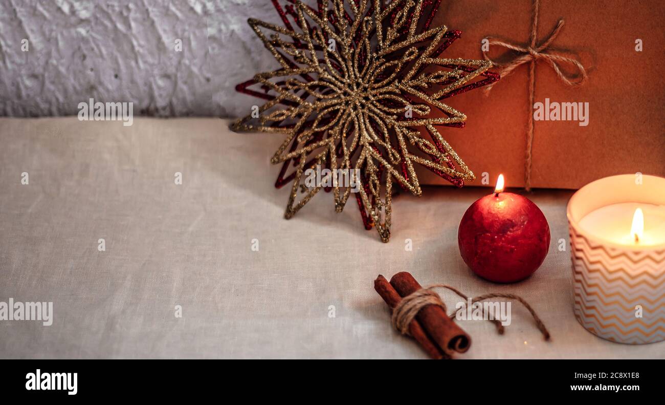 Christmas or new year composition. Christmas decorations in gold and red colors with copy space for text. Stock Photo