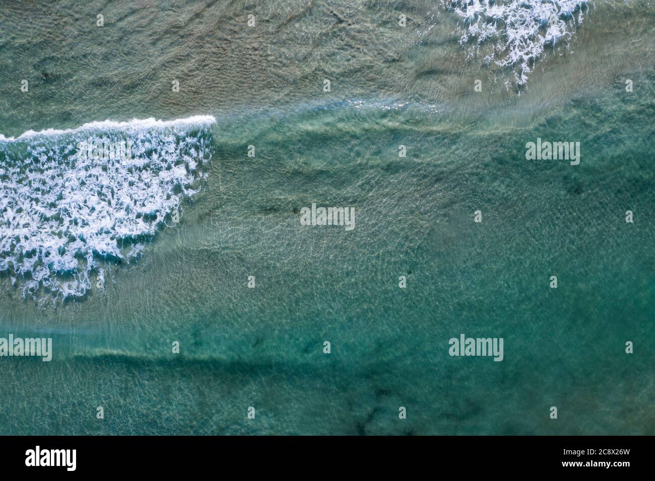 Aerial view of tropical sandy beach and blue ocean with crystal clear ...