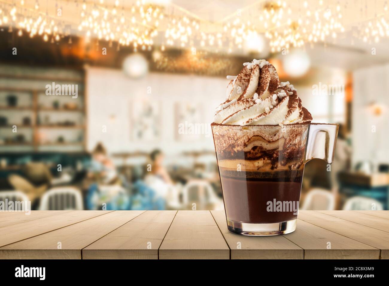 Cup of coffee with whipped cream on wooden table into coffee shop Stock ...