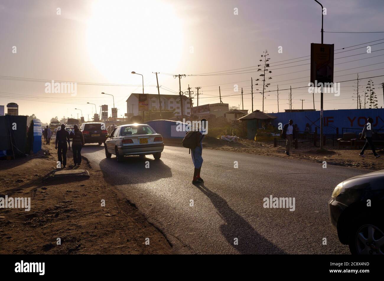 People walking along Ngong Road during the evening rush hour,  Ngong Road, Nairobi, Kenya.  3 Mar 2015 Stock Photo