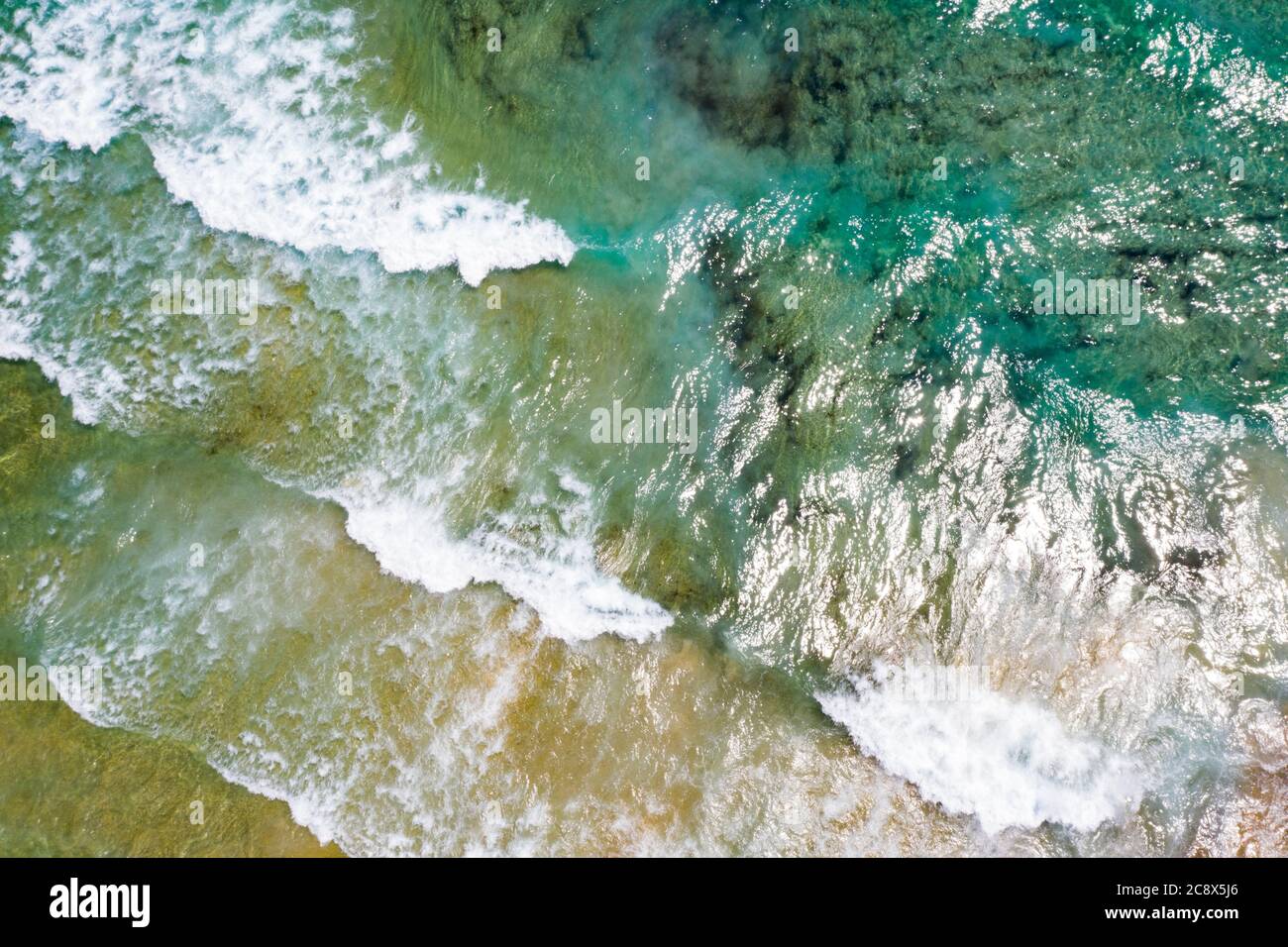 Aerial view of tropical sandy beach and blue ocean with crystal clear ...