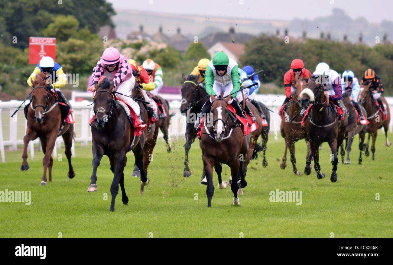 Fools Rush In and Richard Kingscote (pink, left) winning the British stallion studs ebf novice stakes at Redcar Racecourse, North Yorkshire. Stock Photo