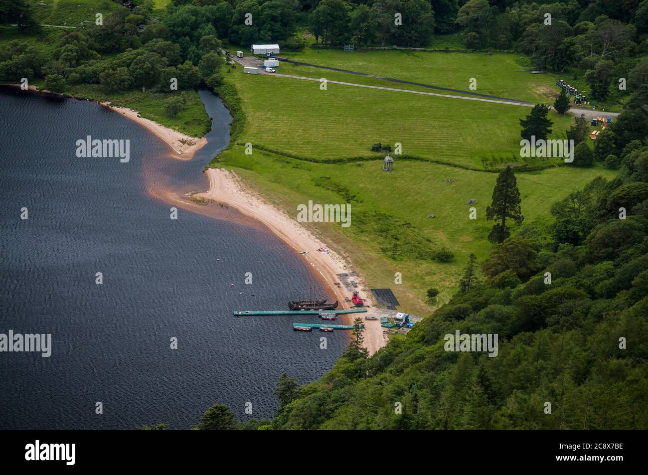 Viking drakkar moored to the pontoon at Lough Tay, Lugalla, Wicklow Mountains, Ireland, where “Braveheart” and “Vikings” were filmed. Stock Photo