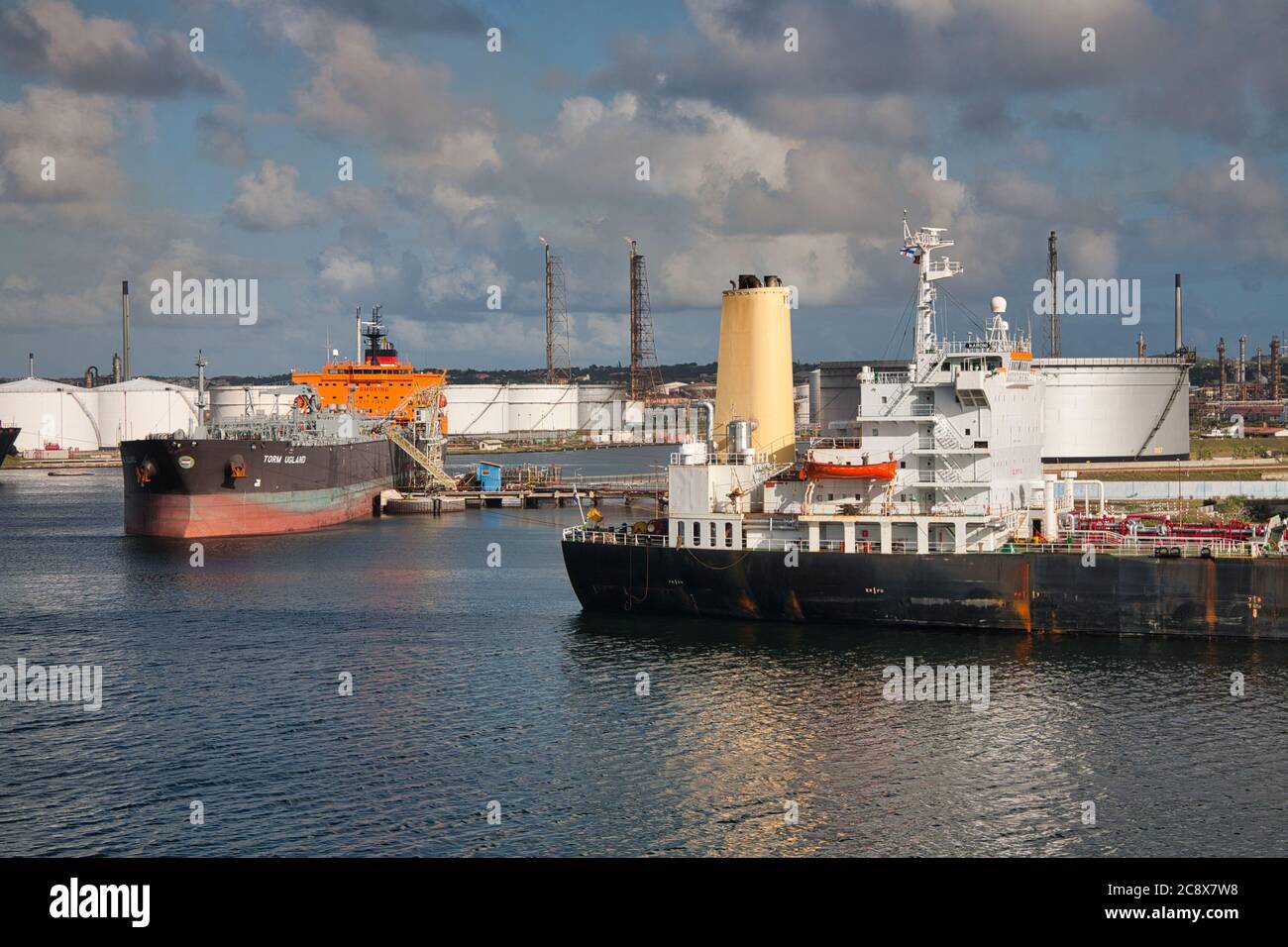 Two tankers moored at an oil refinery on the outskirts of Willemstad, Curacao, The Caribbean Stock Photo