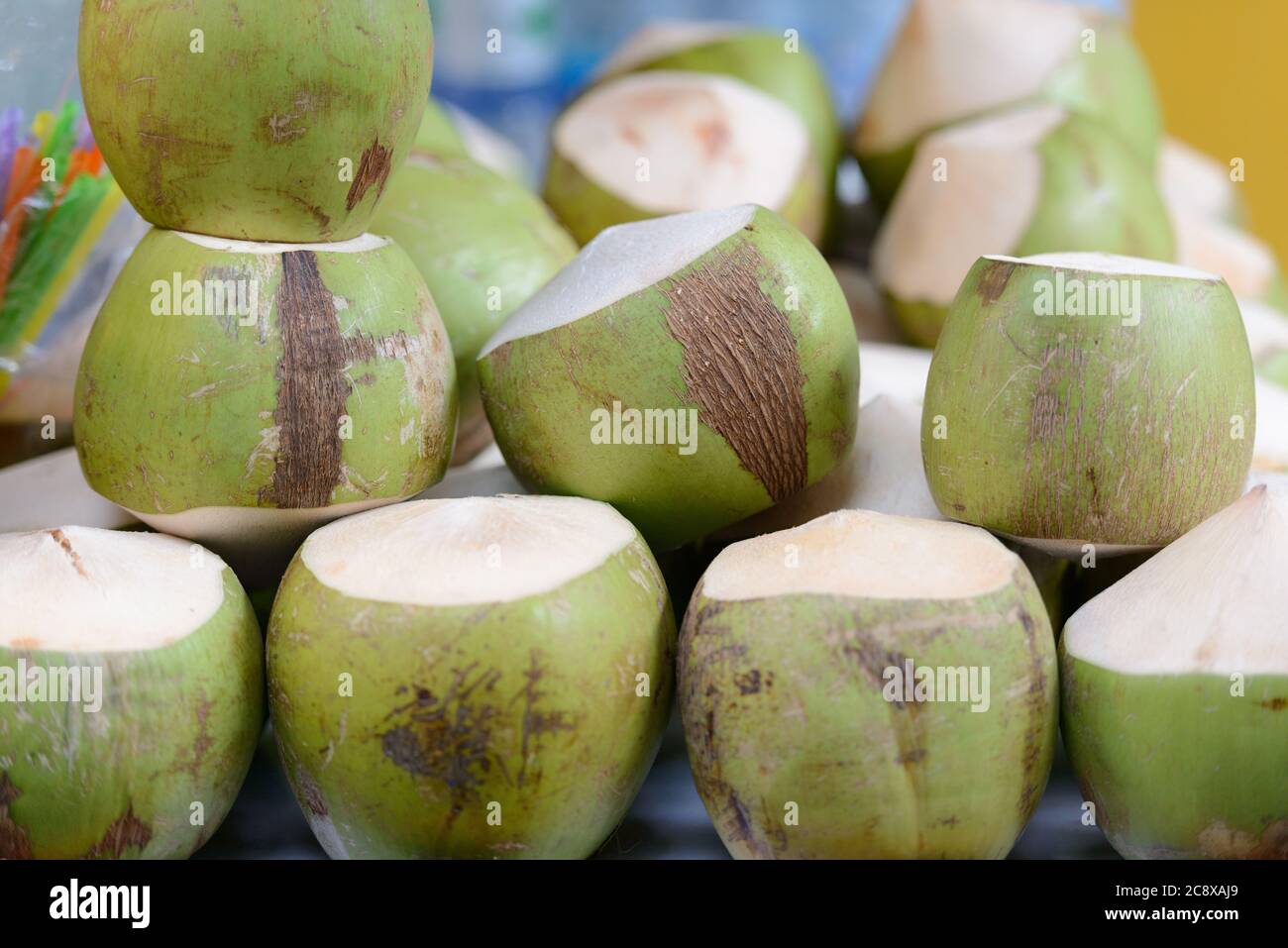 Pile of young coconuts in the market Stock Photo Alamy