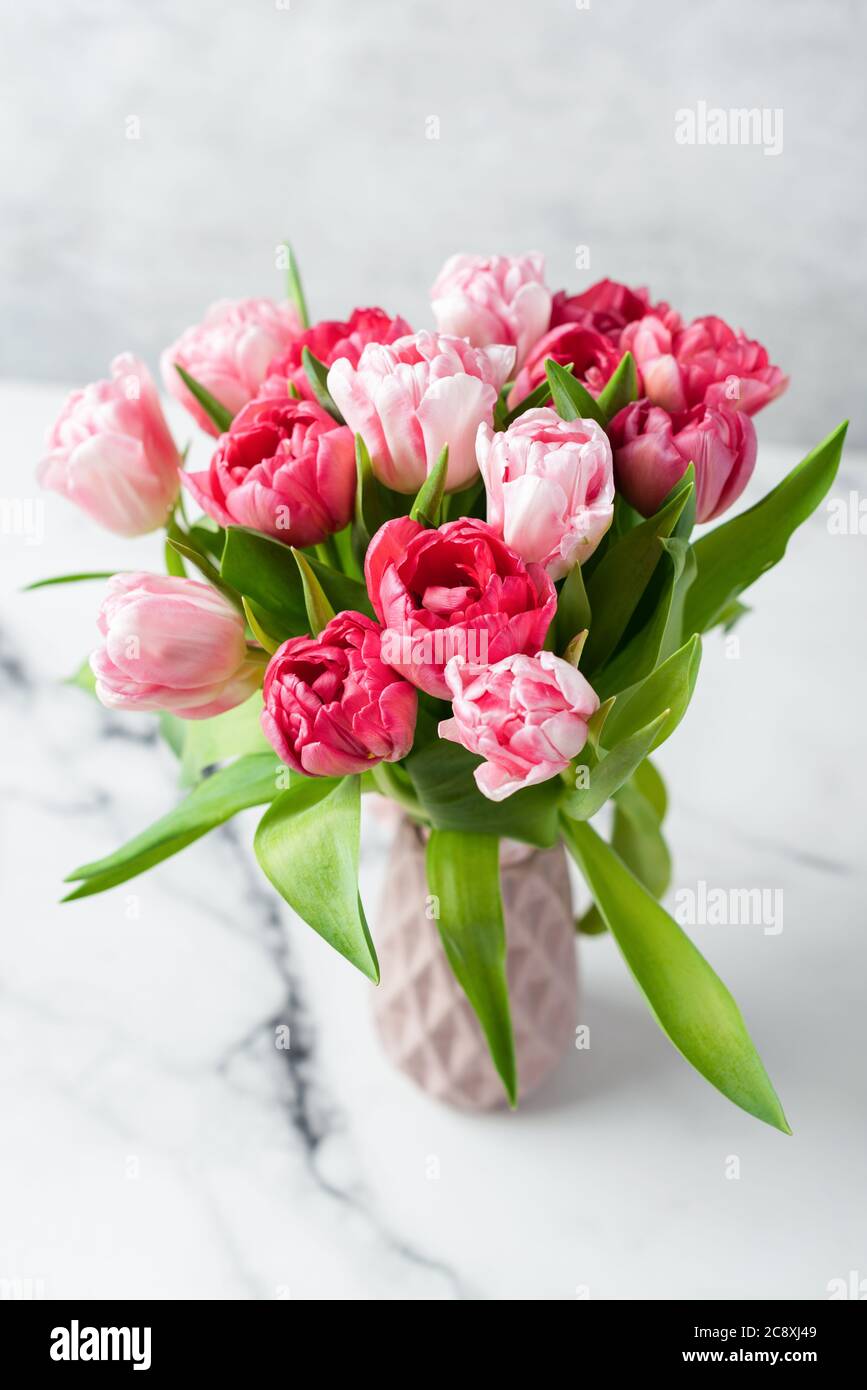 Bouquet of pink peony tulips in vase. Holiday flowers bouquet, wedding or 8  March concept Stock Photo - Alamy