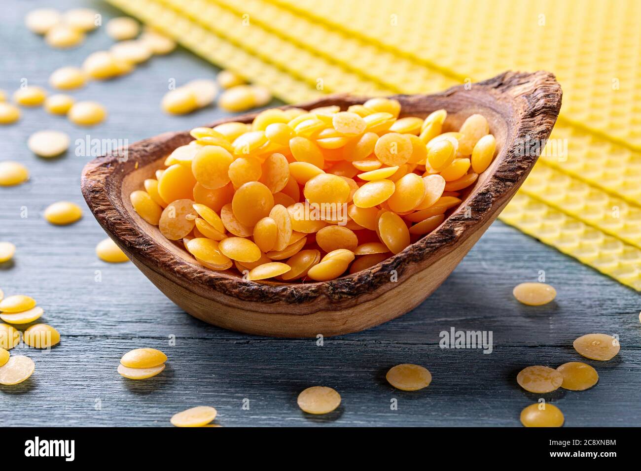 Beeswax pellets in the bowl Stock Photo