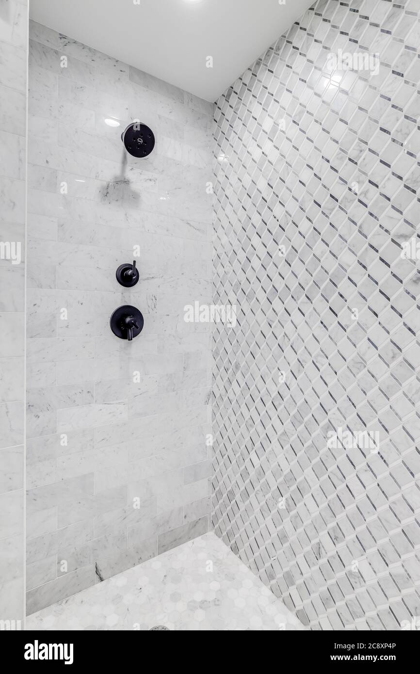 A custom tiled shower with black hardware Stock Photo Alamy