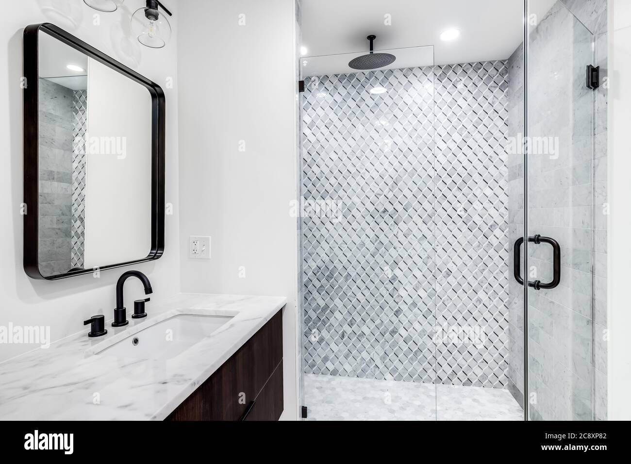 A Beautiful Modern Bathroom With A Wood Vanity