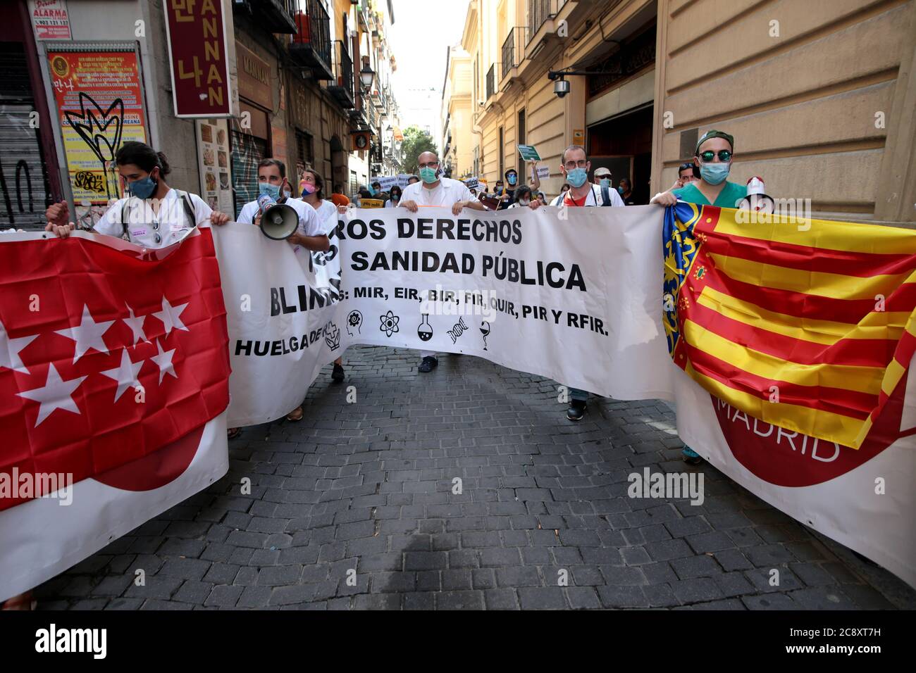 Madrid Spain; 27/07/2020.- Baner: Our rights protect public health.Internal  Resident Doctors (MIR) take to the streets for the third time this month to  demand to negotiate with the Madrid government about their