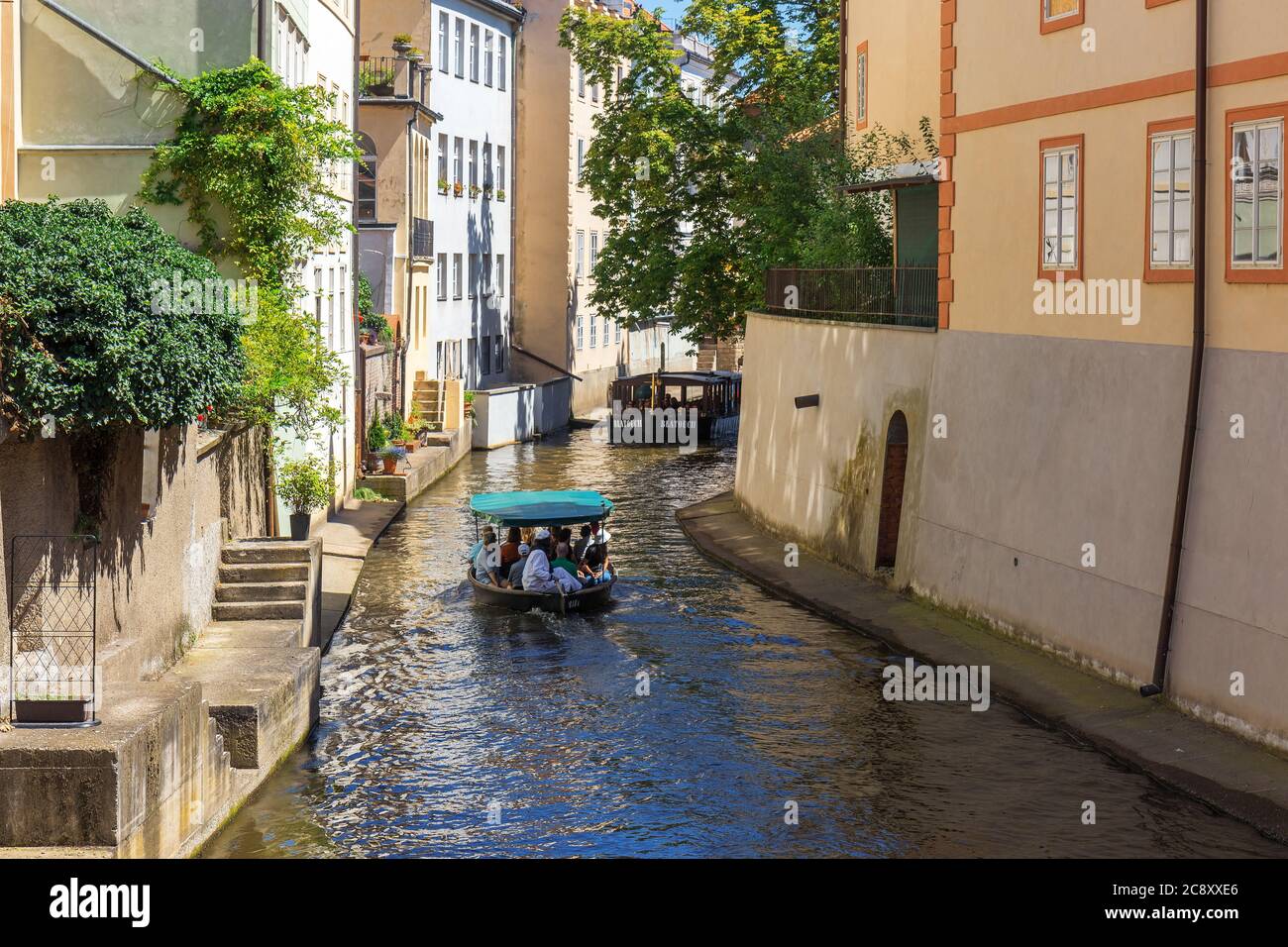 Kampa, Prague - July 22: 2 sightseeing boats with tourists at Devil Stream at Kampa, Lesser Town in Prague on July 22, 2020. Stock Photo