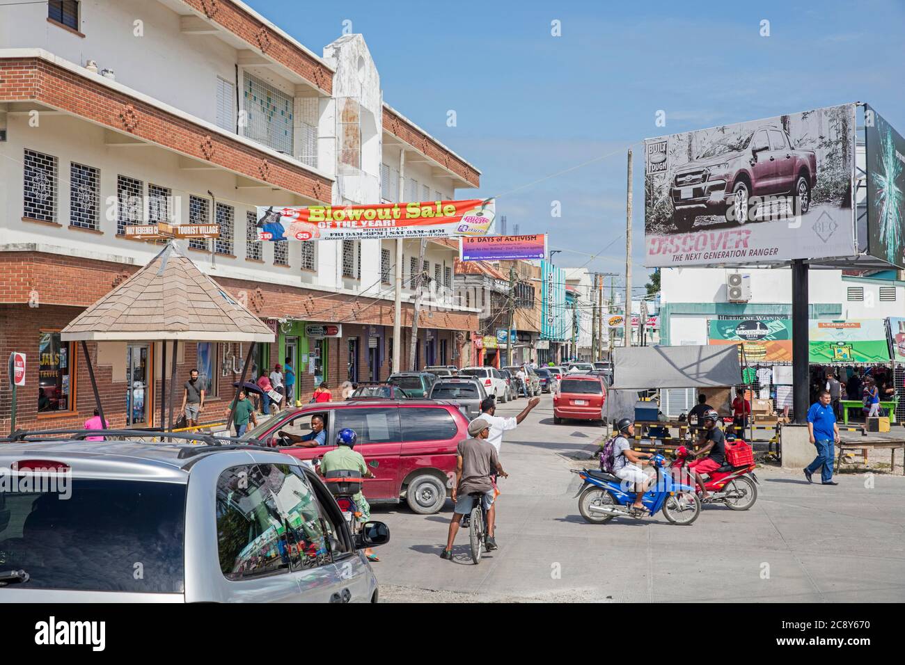 Traffic in busy shopping street in Belize City, Caribbean, Central America Stock Photo