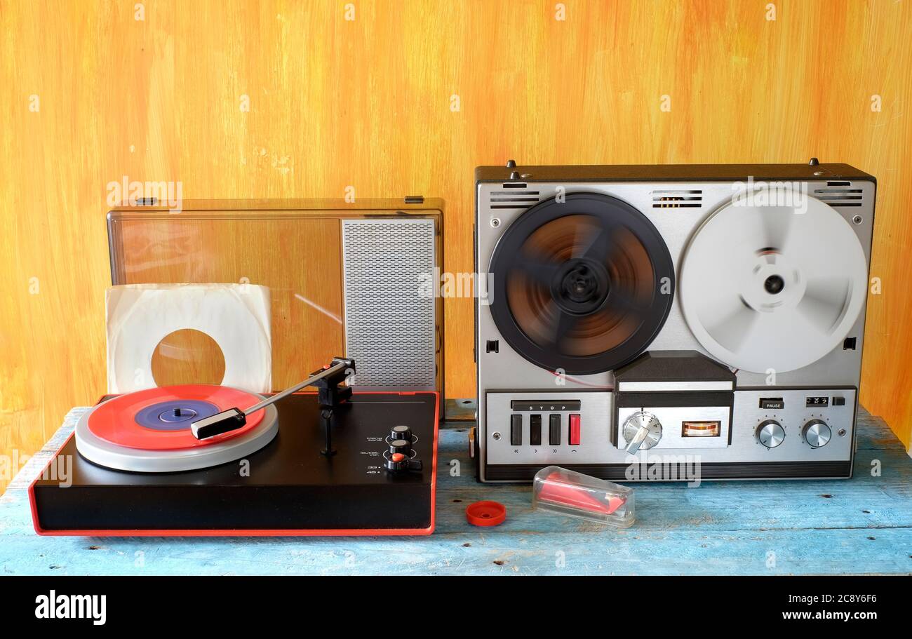 Vintage reel to reel tape recorder, and old turntable vintage audio gear in  full action Stock Photo - Alamy