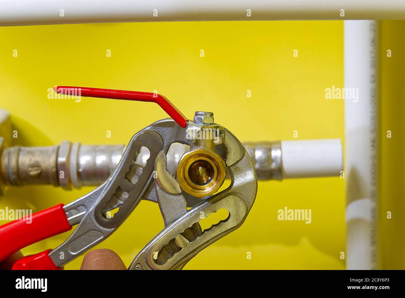 connecting plumbing fittings with keys. The plumber assembles a new