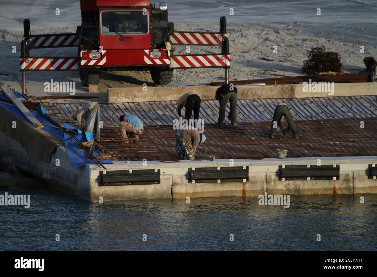 Team of workers carrying out expansion of the port Stock Photo