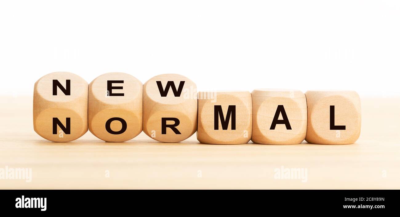 New Normal concept. Wooden blocks with text on table. Copy space Stock Photo