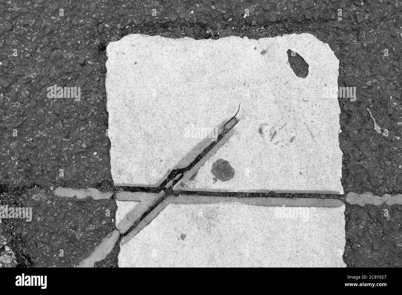 Black and white marking on a footpath Stock Photo