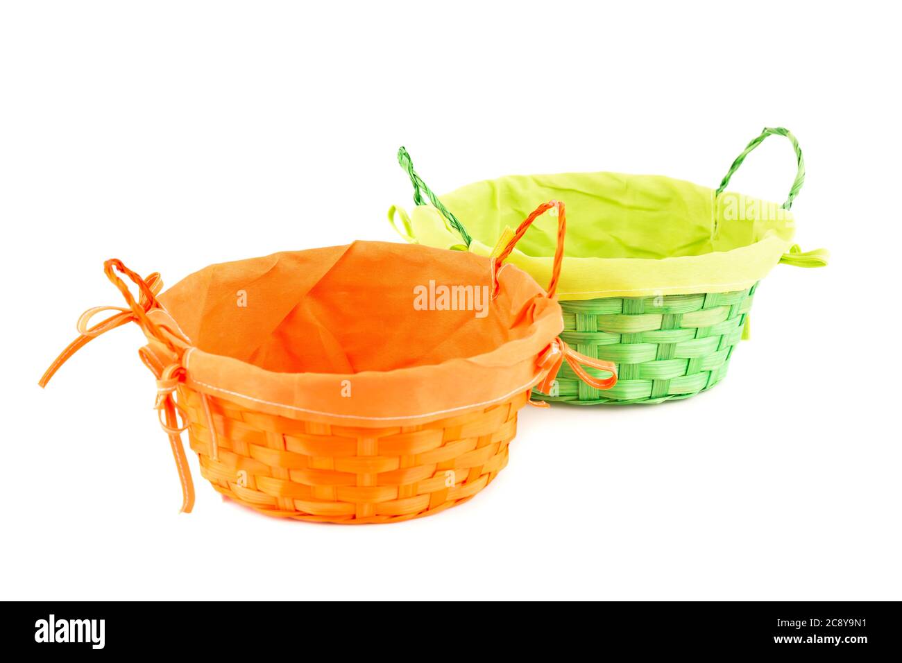 Two empty wicker baskets isolated on white background. Stock Photo
