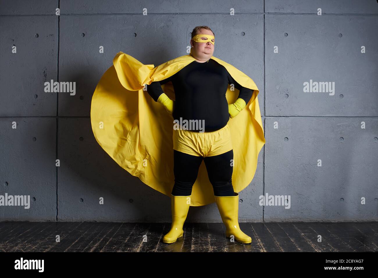 fantastic fat superhero man is defender of universe, ready to solve all problems, brave and strong. isolated Stock Photo