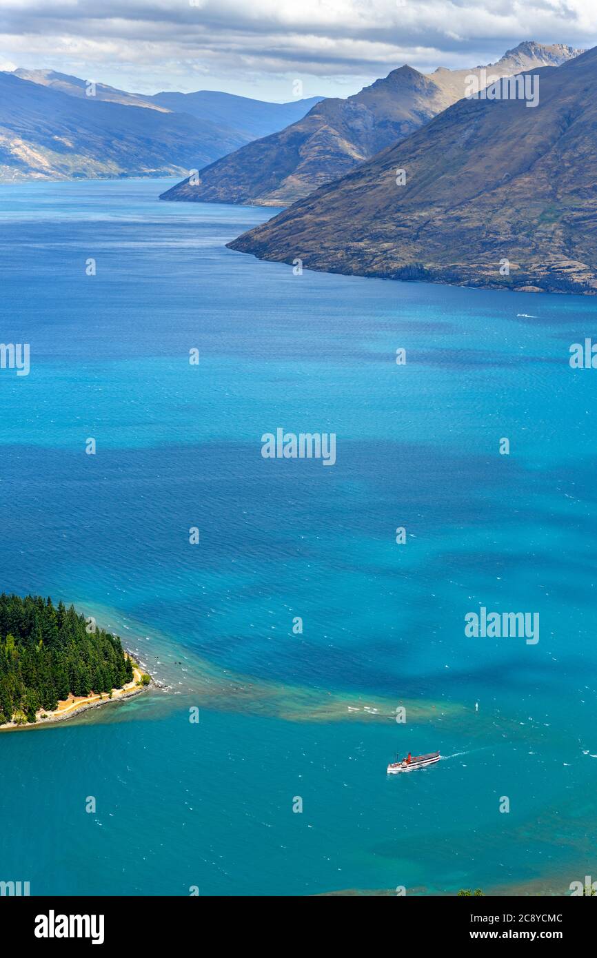 View over Lake Wakatipu, from the top of the Skyline Gondola, with the TSS Earnshaw heading into Queenstown, New Zealand Stock Photo